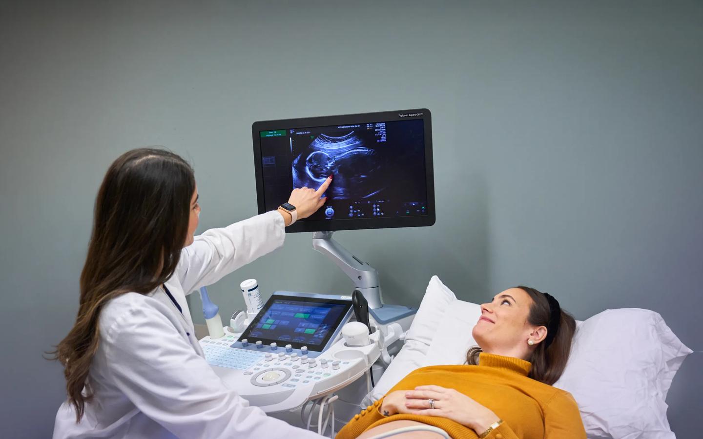 Reena Bogart, an ultrasound technician, left, conducts ultrasound imaging on a pregnant patient at NYU Langone Obstetrics and Gynecology Associates.