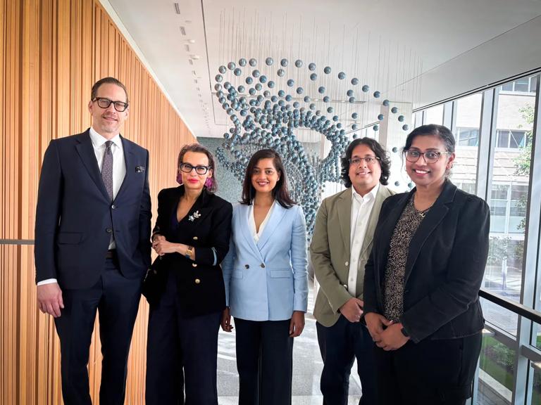 From left to right: Drs. Paul Gardner, Dimitra Skondra, Shae Datta, Arjun V. Masurkar, and Jinsy A. Andrews stand together in an atrium.