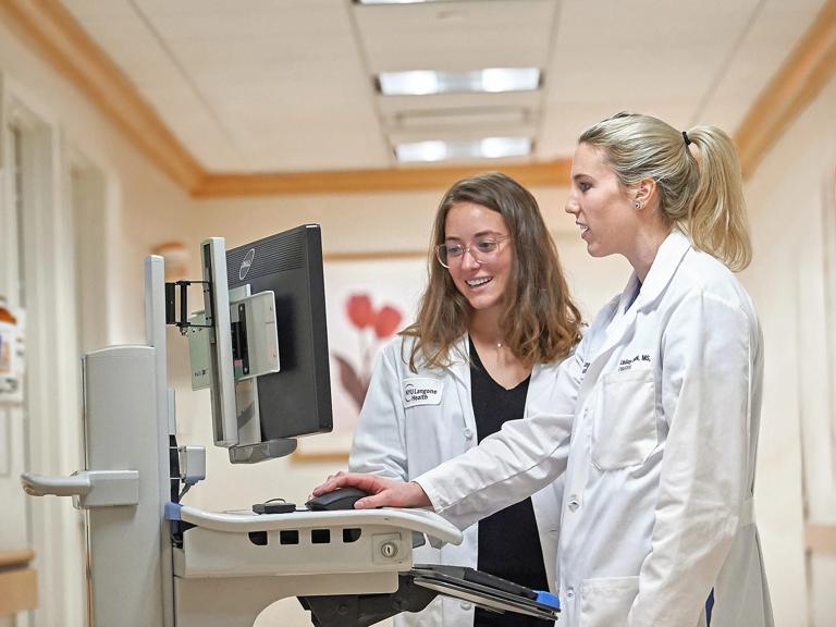 OB-GYN doctors at Joan H. Tisch Center for Women&rsquo;s Health look at patient records in a computer.