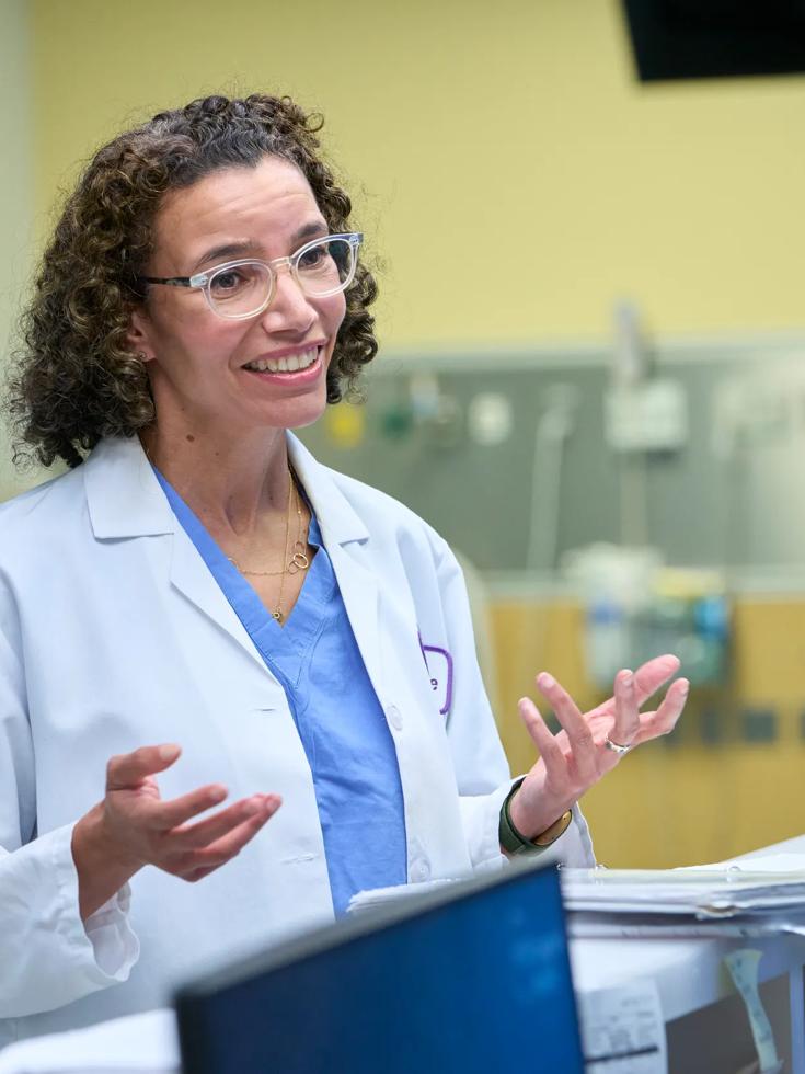 Leslie Boyd, MD, stands while talking with someone out of frame.