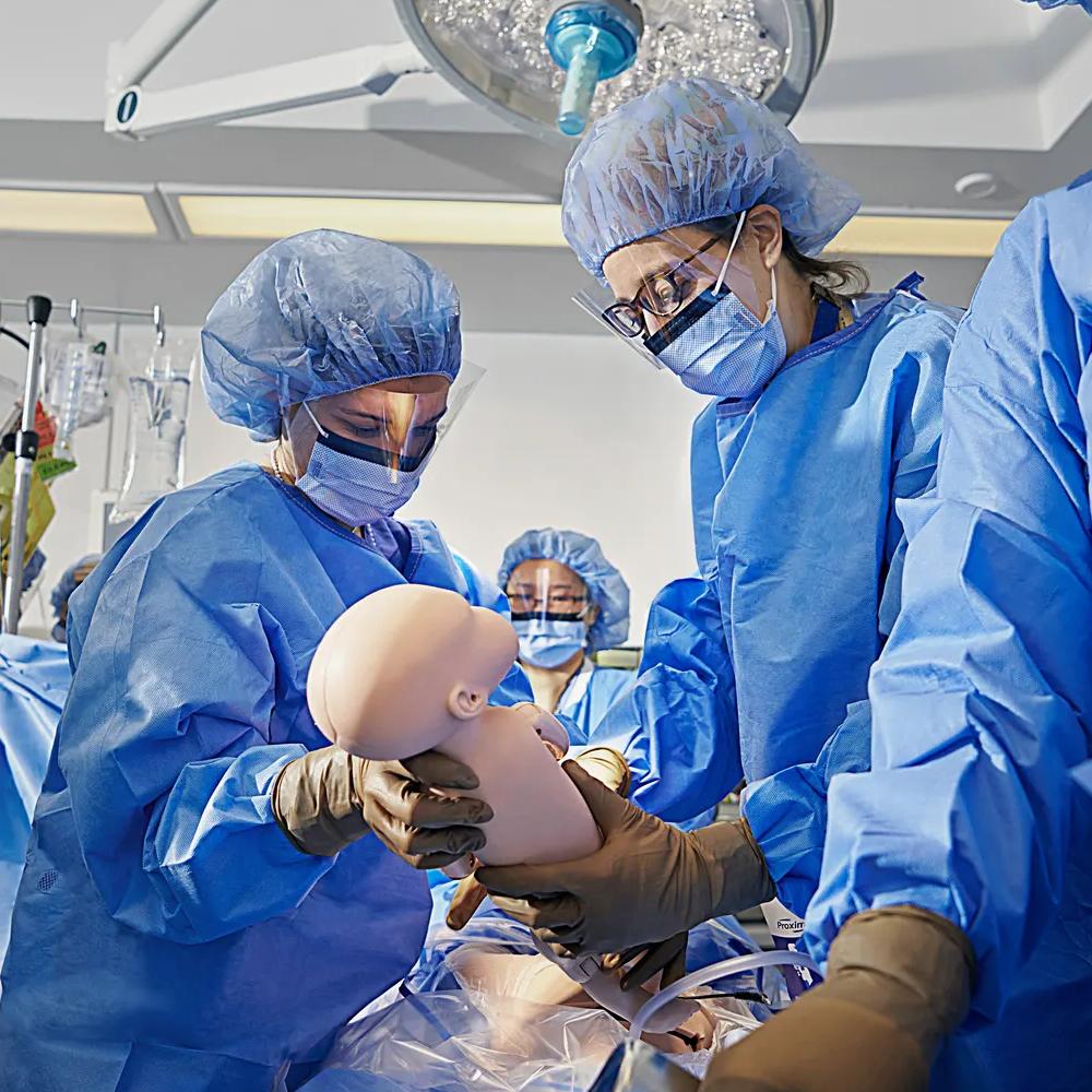 Medical students learn how to deliver a baby in NYU Grossman School of Medicine's simulation center.