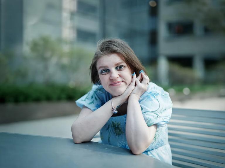 Molly Eschenbach its outside and looks directly at camera.