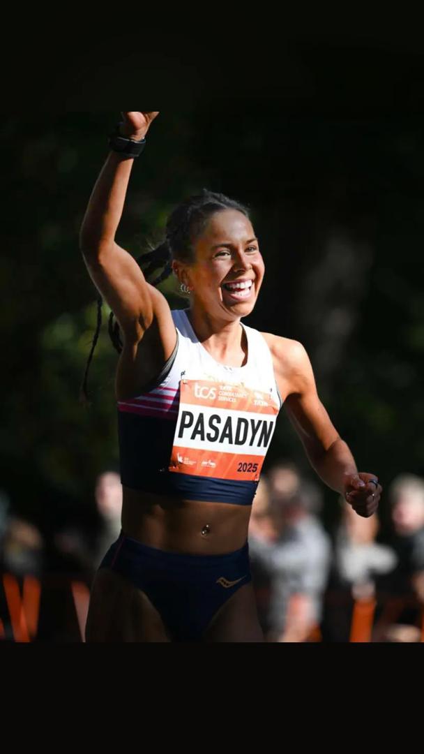 Felicia Pasadyn, a student at NYU Grossman School of Medicine, smiling while she runs in the TCS New York City Marathon.
