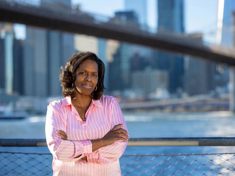 Susan Joseph stands with her arms folded outside in Brooklyn, New York.