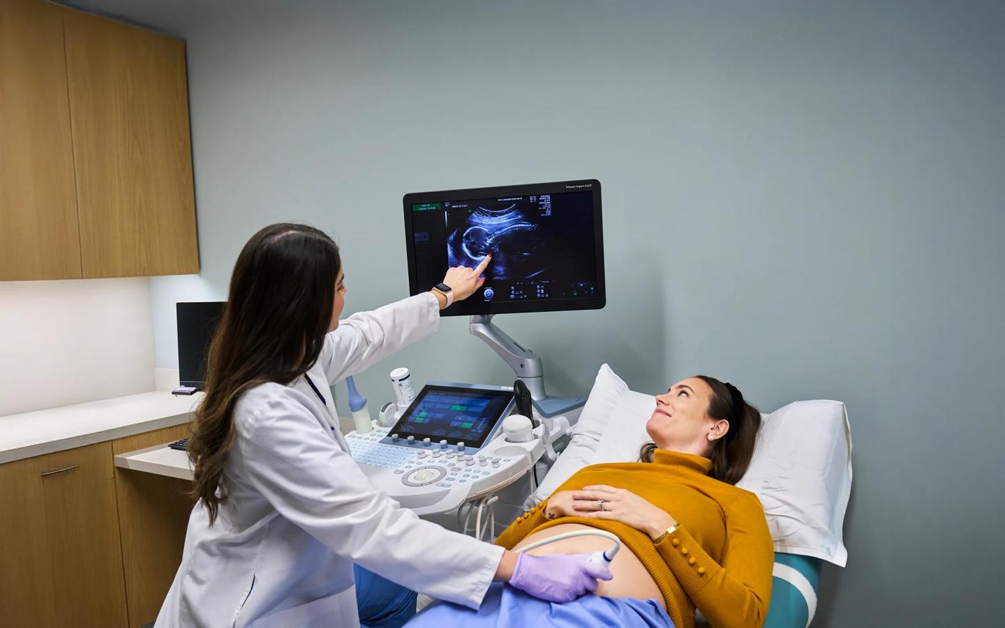 Reena Bogart, an ultrasound technician, left, conducts ultrasound imaging on a pregnant patient at NYU Langone Obstetrics and Gynecology Associates.
