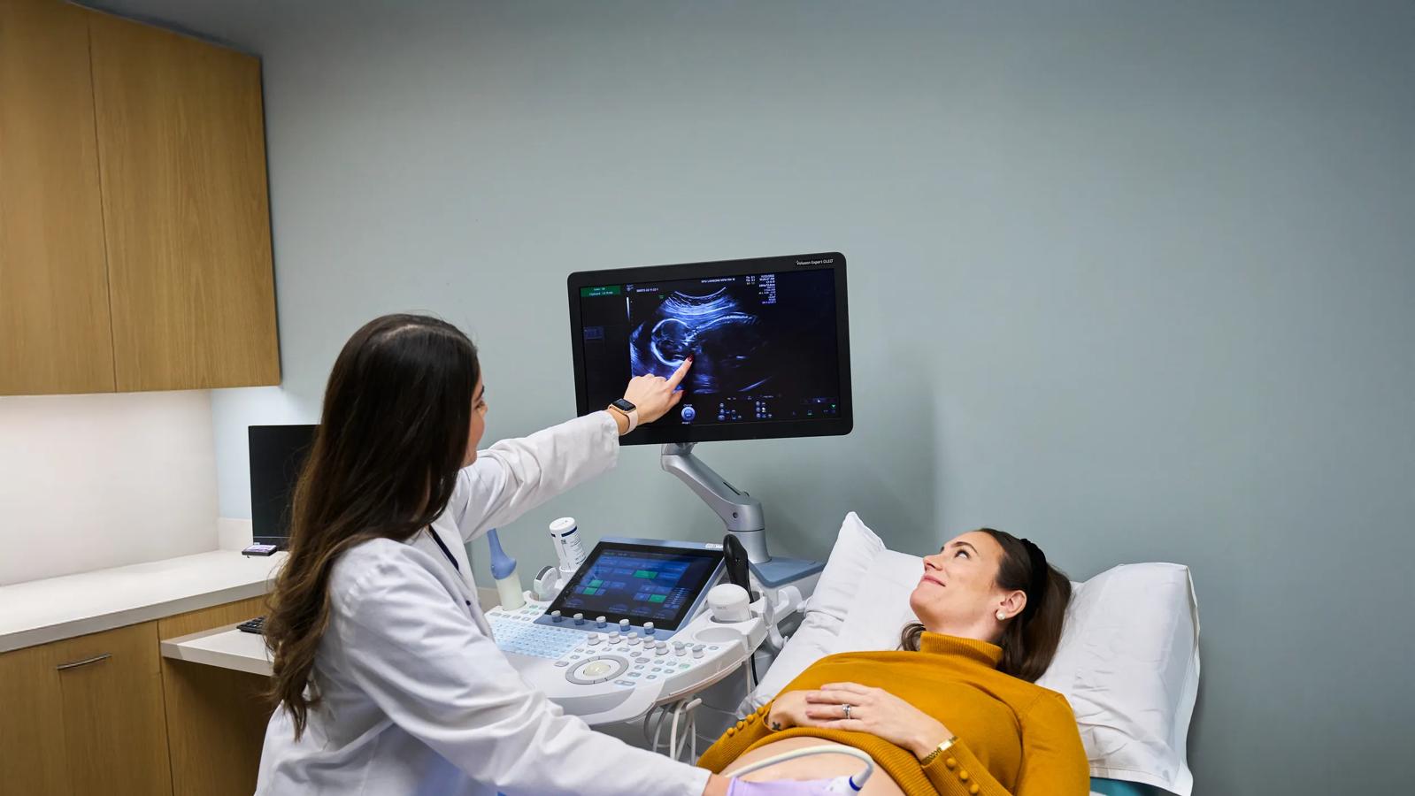 Reena Bogart, an ultrasound technician, left, conducts ultrasound imaging on a pregnant patient at NYU Langone Obstetrics and Gynecology Associates.