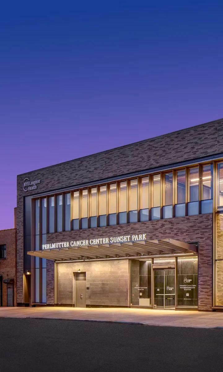 An exterior shot of the entryway of the Perlmutter Cancer Center—Sunset Park building.