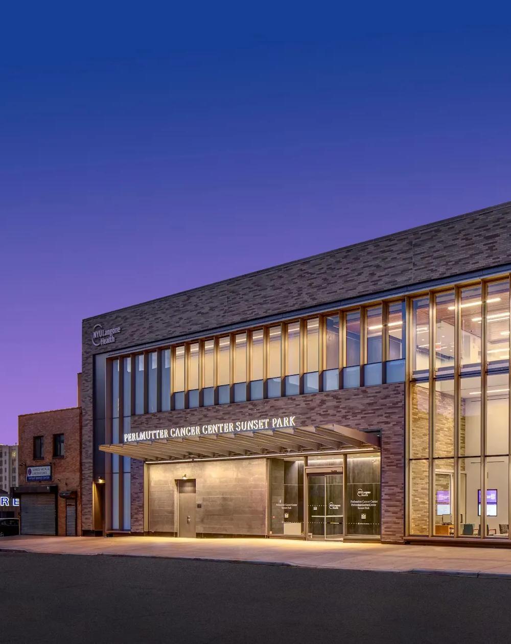 An exterior shot of the entryway of the Perlmutter Cancer Center—Sunset Park building.