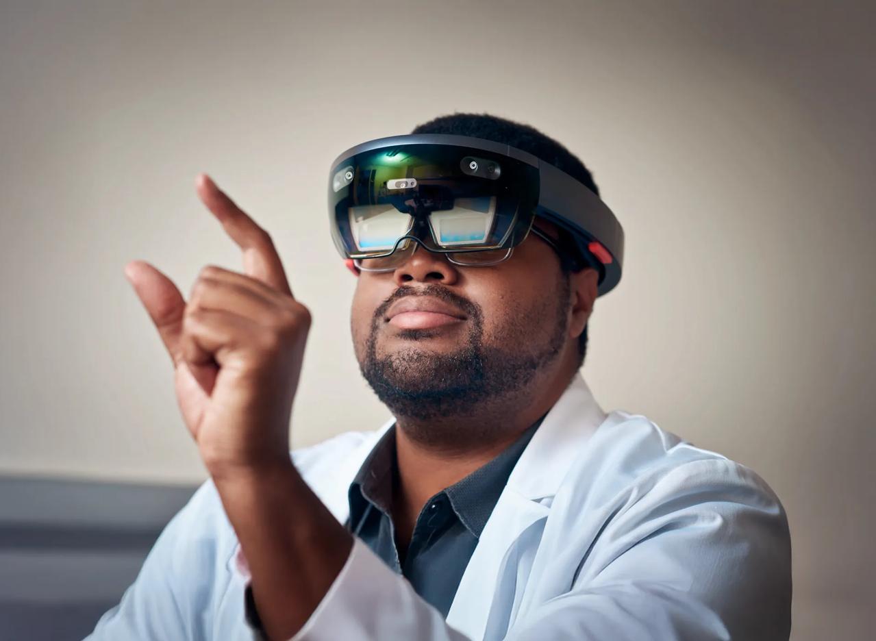 Gregory Dorsainville, Manager of Immersive Computing at the Institute for Innovations in Medical Education wears a VR headset.